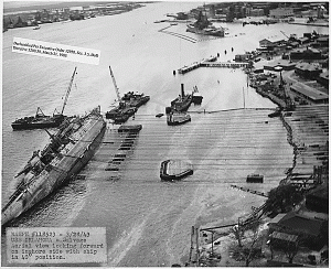 Righting the capsized USS Oklahoma. March 1943. Source: PHNSY, National Archives ID 118523
