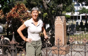 Nanette Napoleon stands by the King Street Catholic Cemetery, across the street from Straub Clinic & Hospital. Her talk on “Gravestones and History: Cemeteries as Genealogical Resources” will kick off the 28th annual historic preservation lecture series, themed “Preserving Our Historic Cemeteries.” (Photo courtesy of Dodge Purnell.)