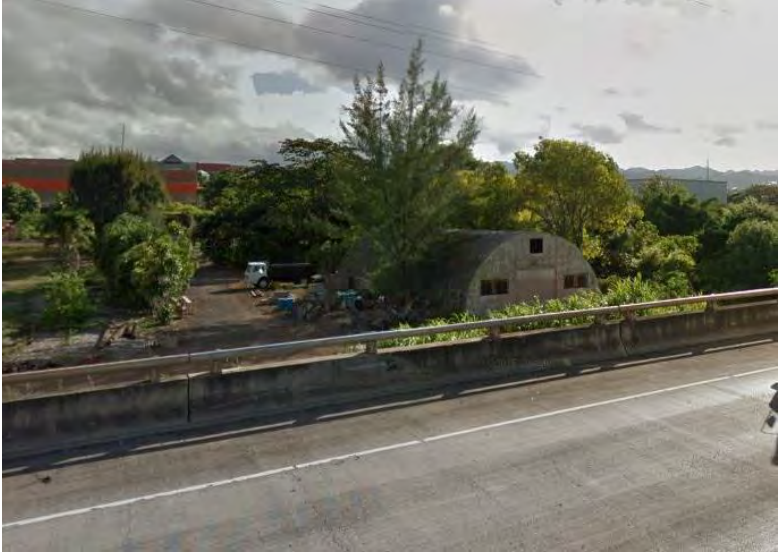 View of Quonset Hut 33 and the O‘ahu Urban Garden from the Queen Lili'uokalani Freeway, camerafacing northeast. From Google Maps, August 2011.