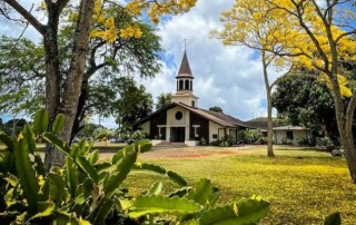 Lili’uokalani Protestant Church, in its current location, framed by fragrant Night-Blooming Cereus and glorious Golden Trumpet trees. Photo by Sara McCurdy